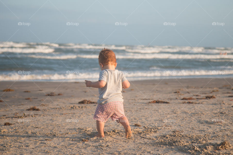 Baby enjoying at beach