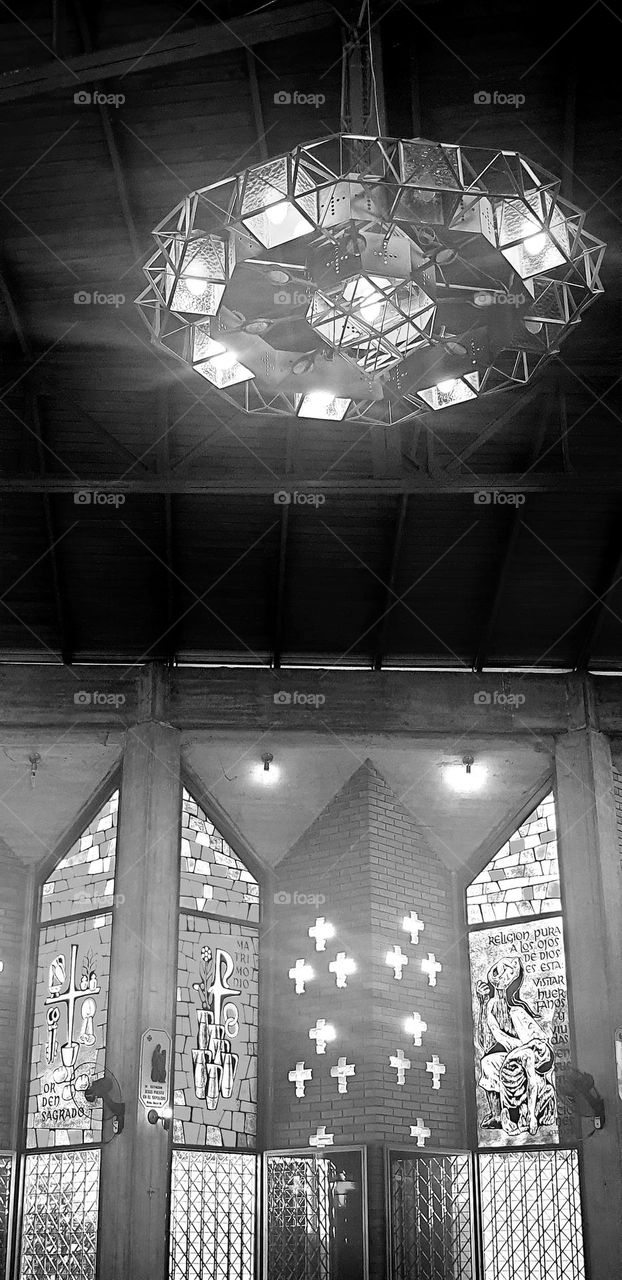 catholic church beautiful stained glass window and chandelier on the ceiling, spectacular architecture