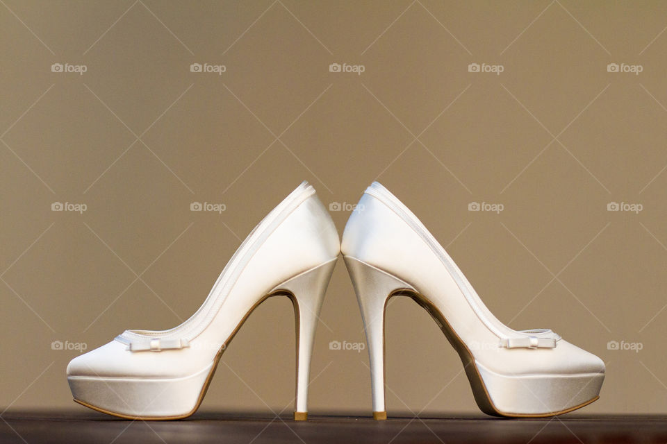 Symmetry and negative space is the focus of this composition. Beautiful high heel shoes.
