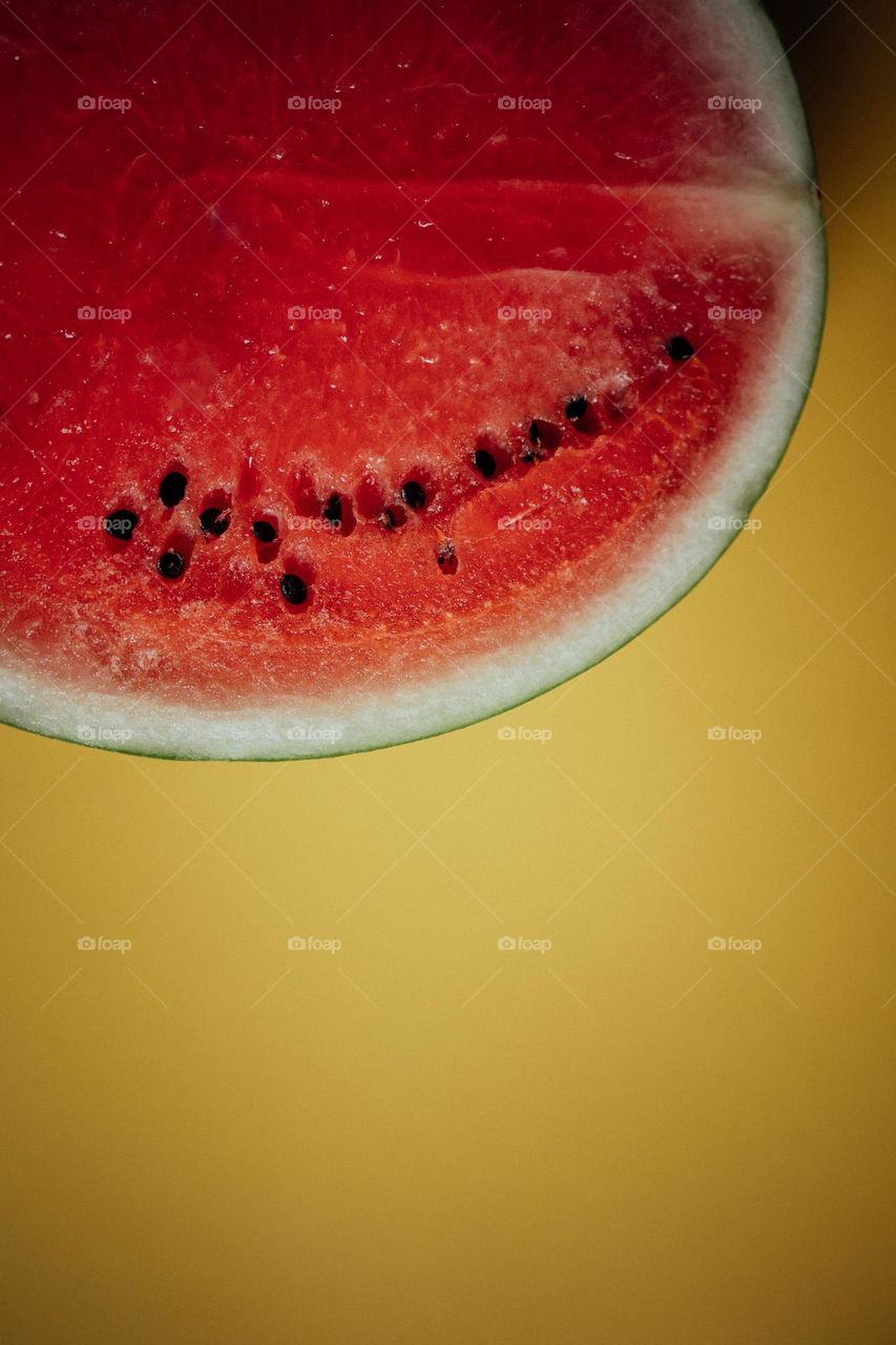 Sliced Watermelon on Yellow Background
