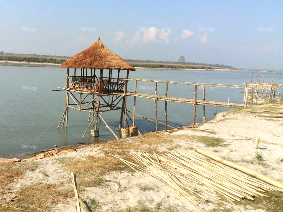 Making hut with bamboo and dry grass near the river for rest.