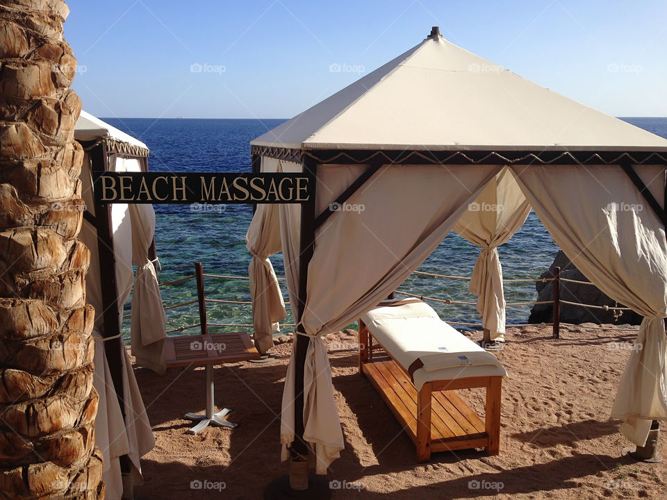 Summer tropical vacation and relaxing massage at the seaside 