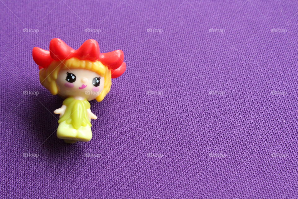 miniature toy on purple background