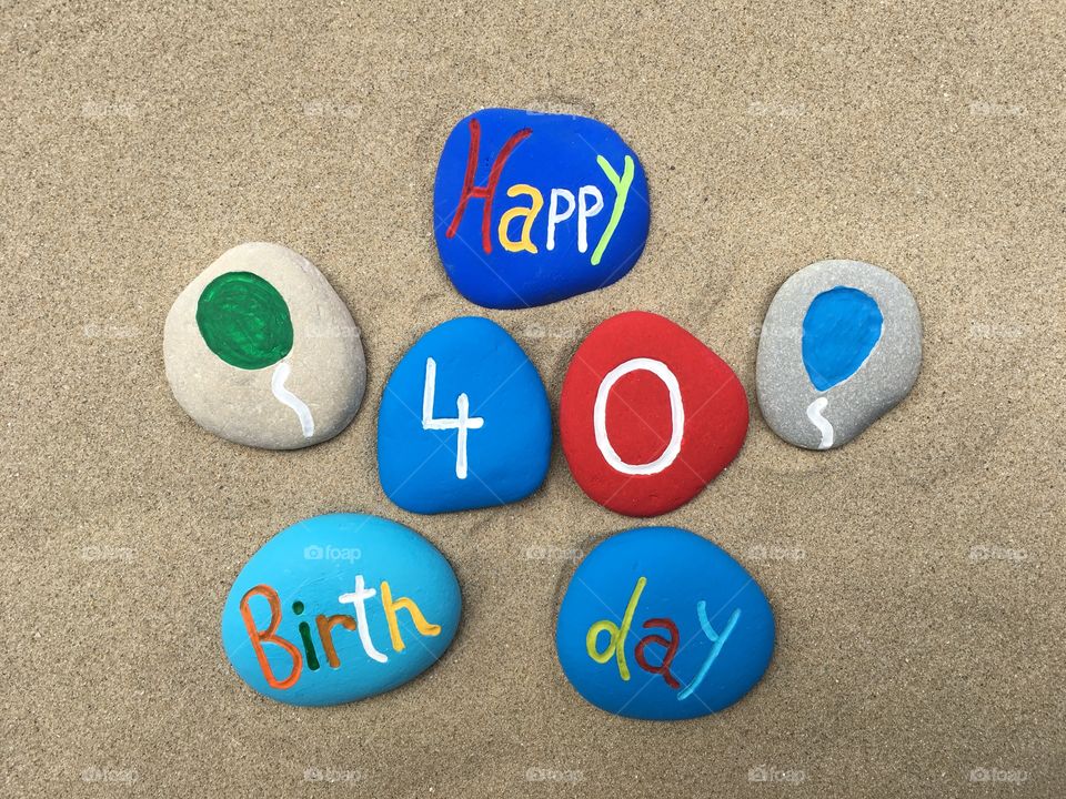 Happy 40 Birthday on colored stones 