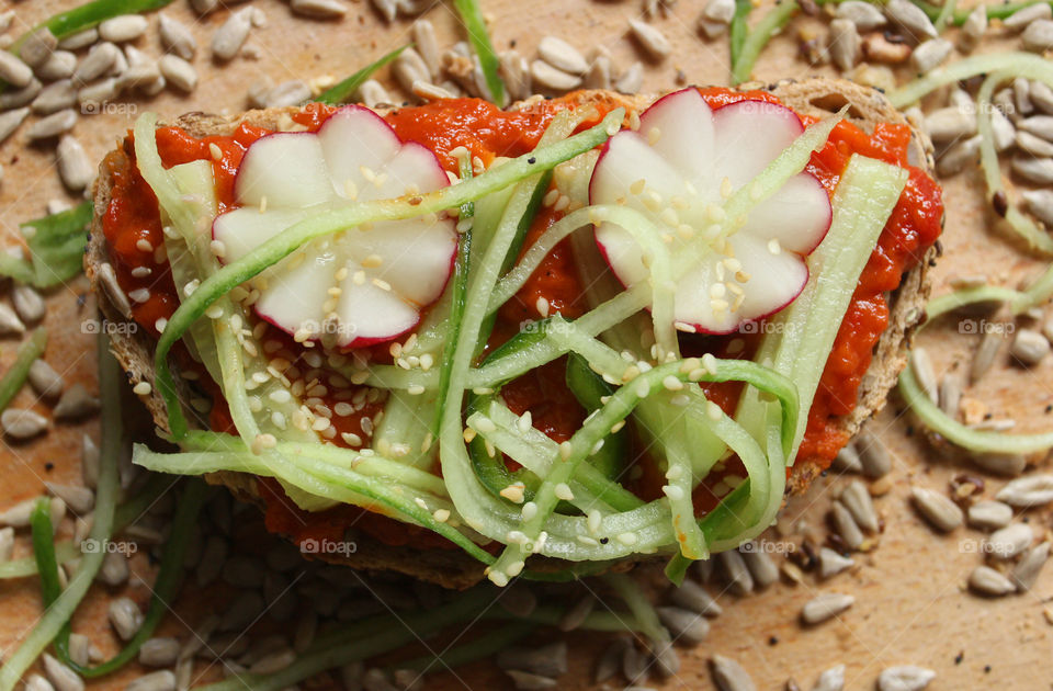 A sandwich with radish and cucumber