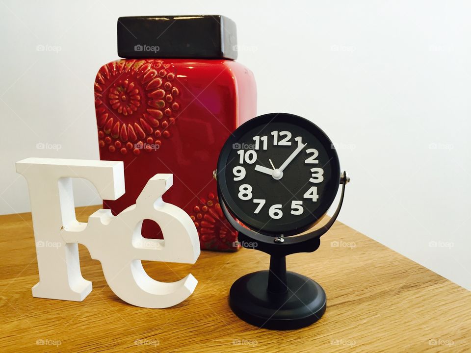 Faith, clock and vase