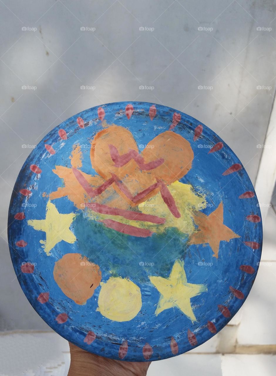 Clay plate painted with water colour