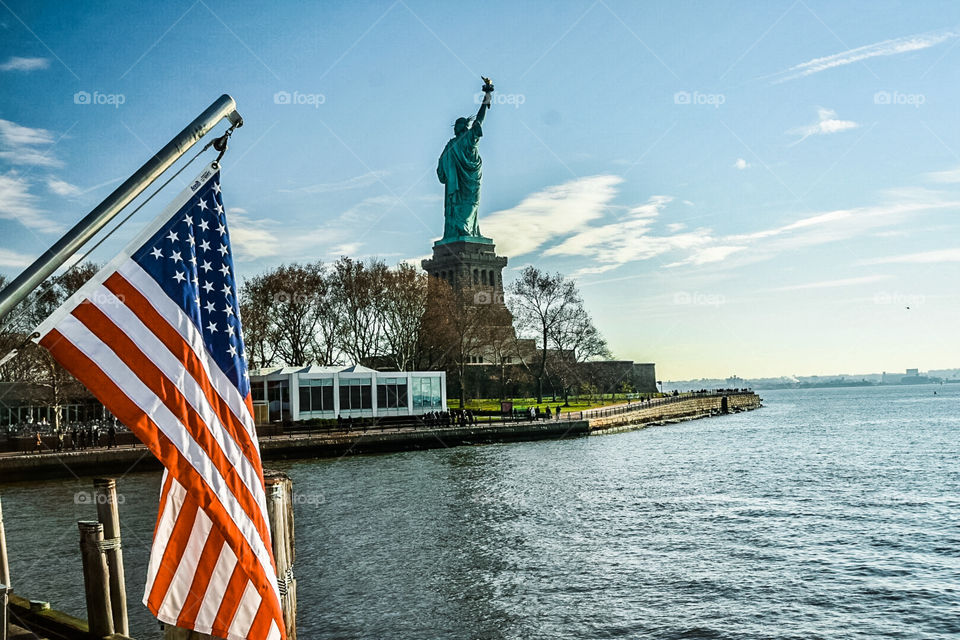 Statue of Liberty with the American Flag
