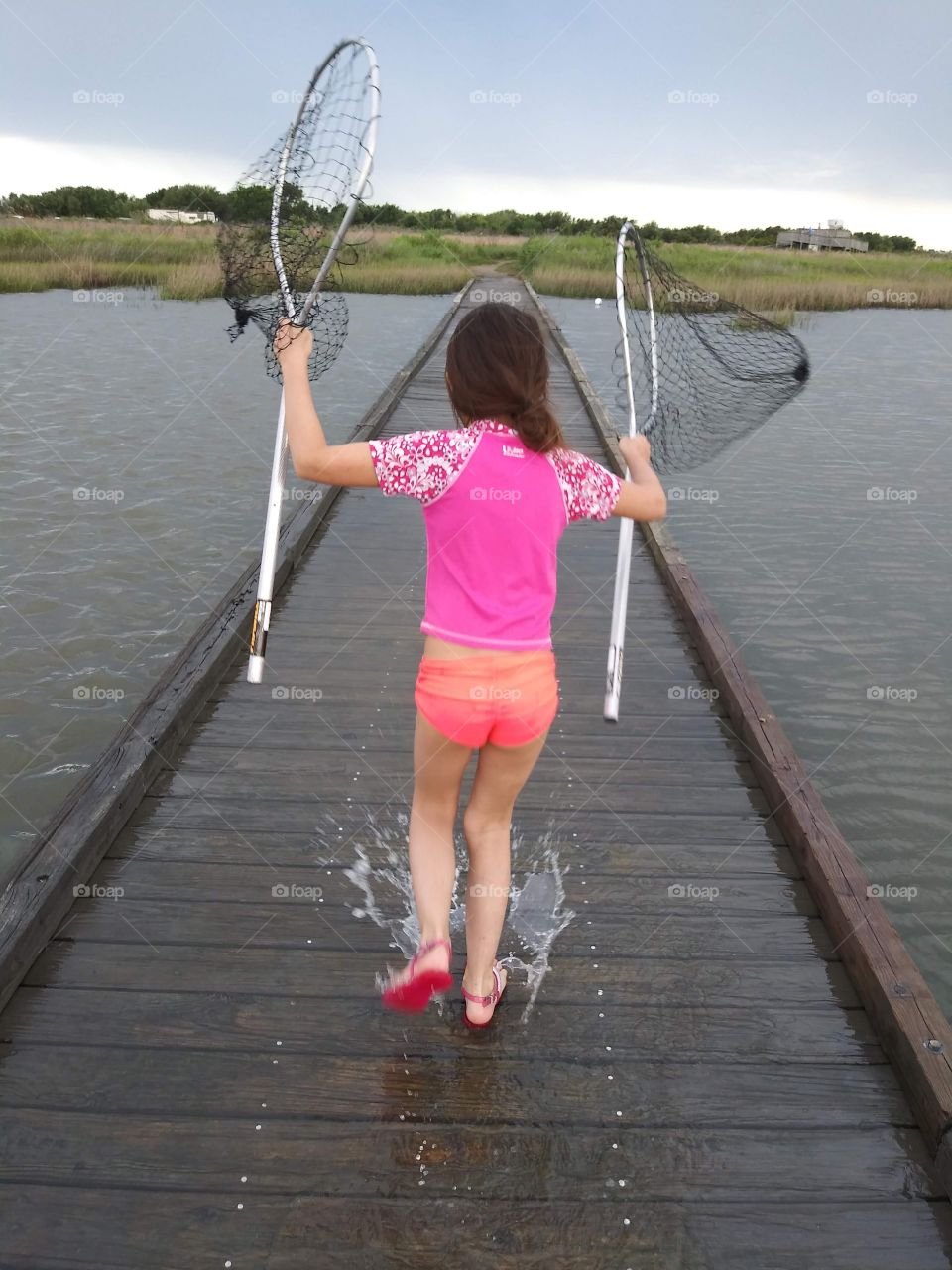 Girl holding crabbing nets
