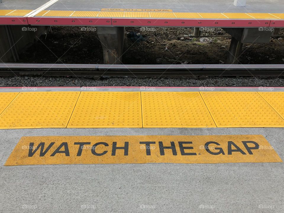 Waiting for the train, watch the gap, commute to work, public transportation, commuting to work by train, riding to work on a train, waiting on the train platform 