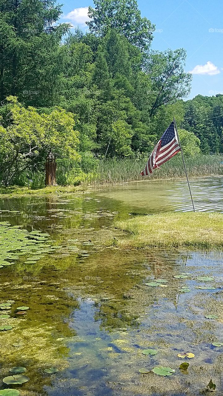 American flag at the lake