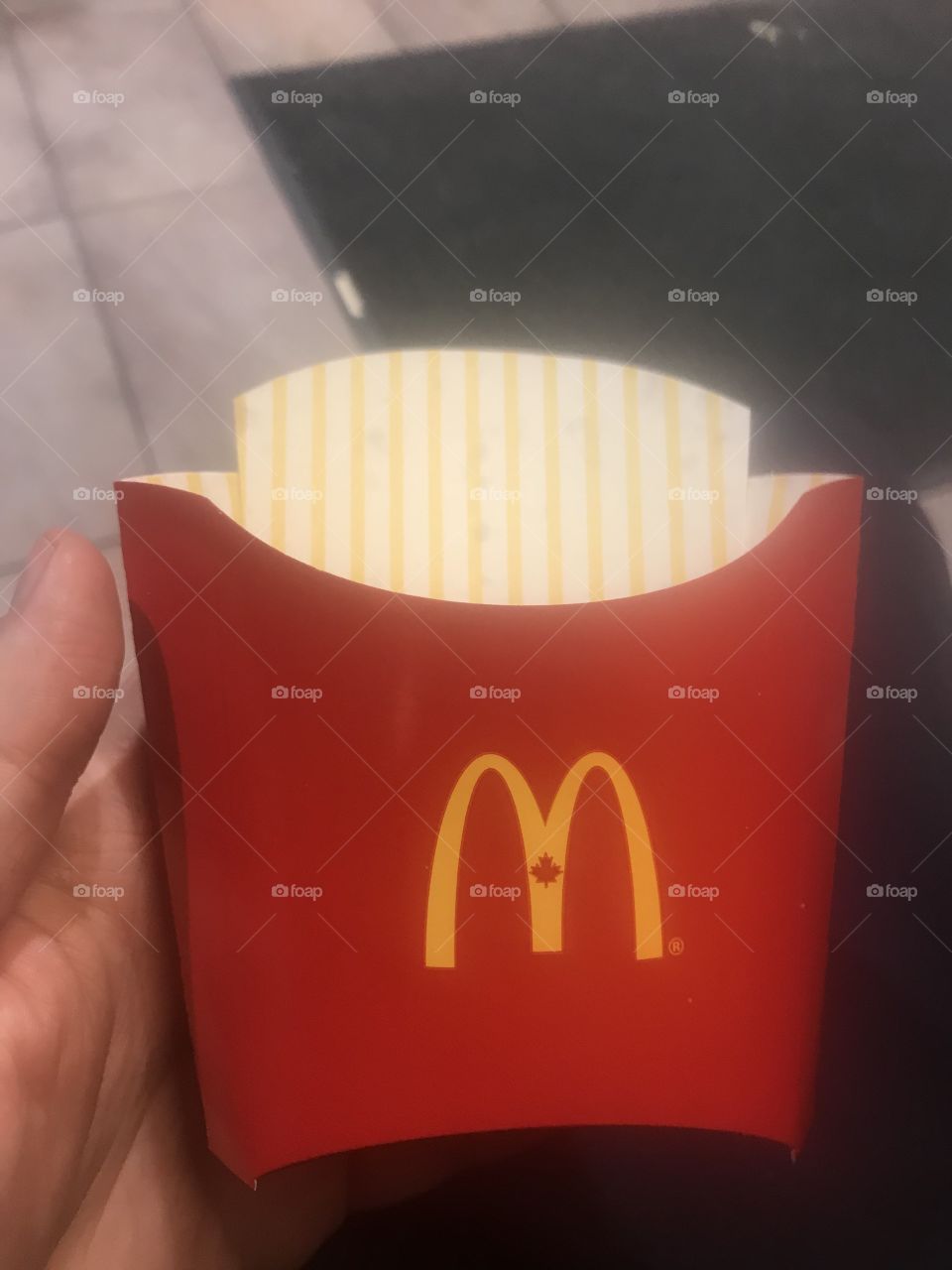 Photo of a McDonalds cup for French fries. It also features the classic M symbol. Great stock photo to use in any news stories about the McDonald’s brand, French fries, the 1$ coffee special and its’ impact on sales in the company re shareholders 