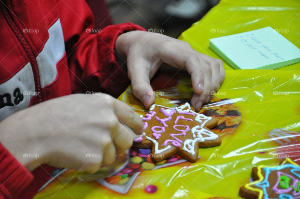 boy decorating cookies