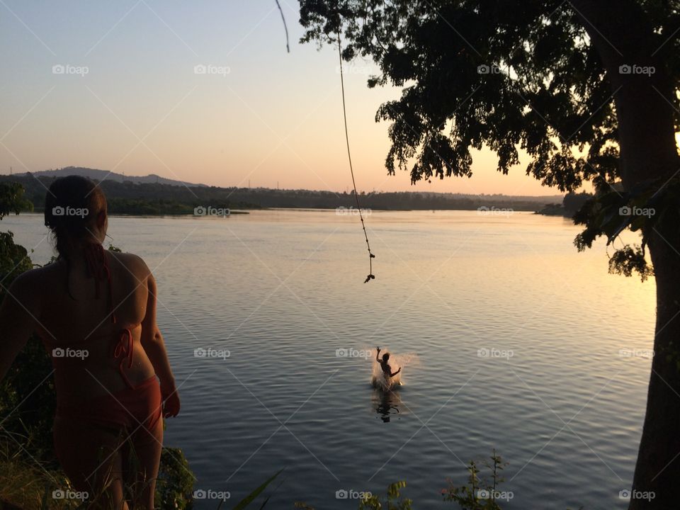 Rope swinging into the Nile at Sunset 