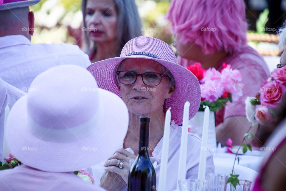 Stylish elder lady dressed in shades of pink