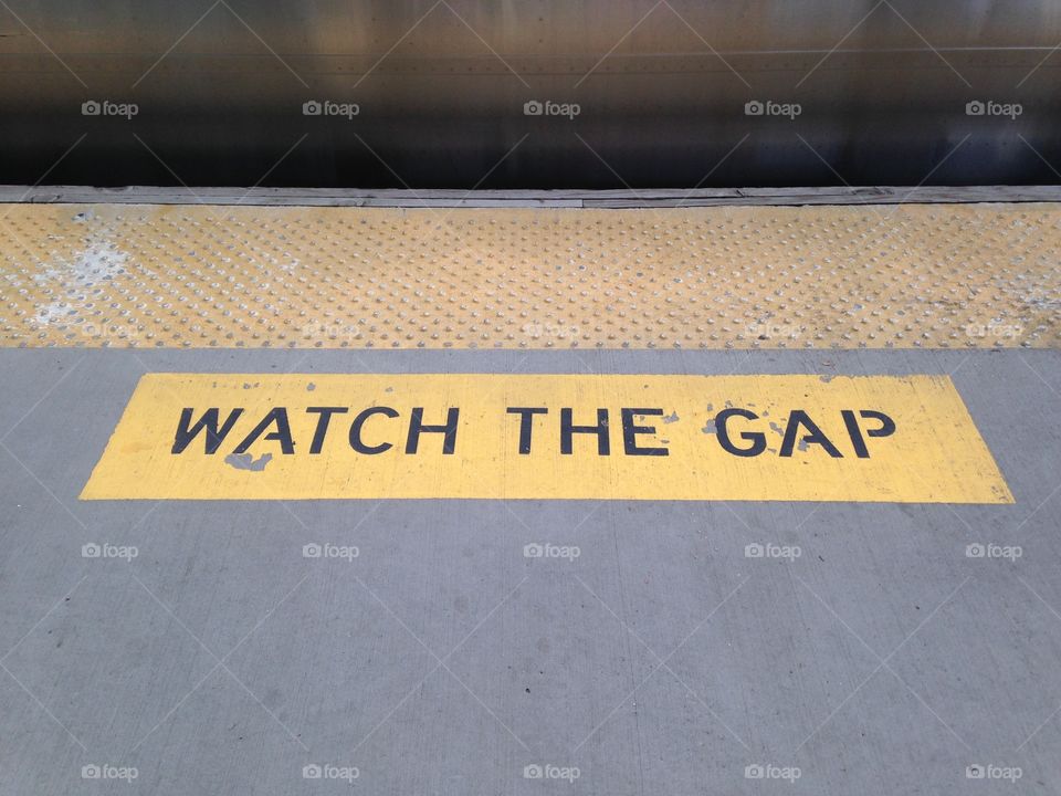 "Watch the Gap" sign on train platform