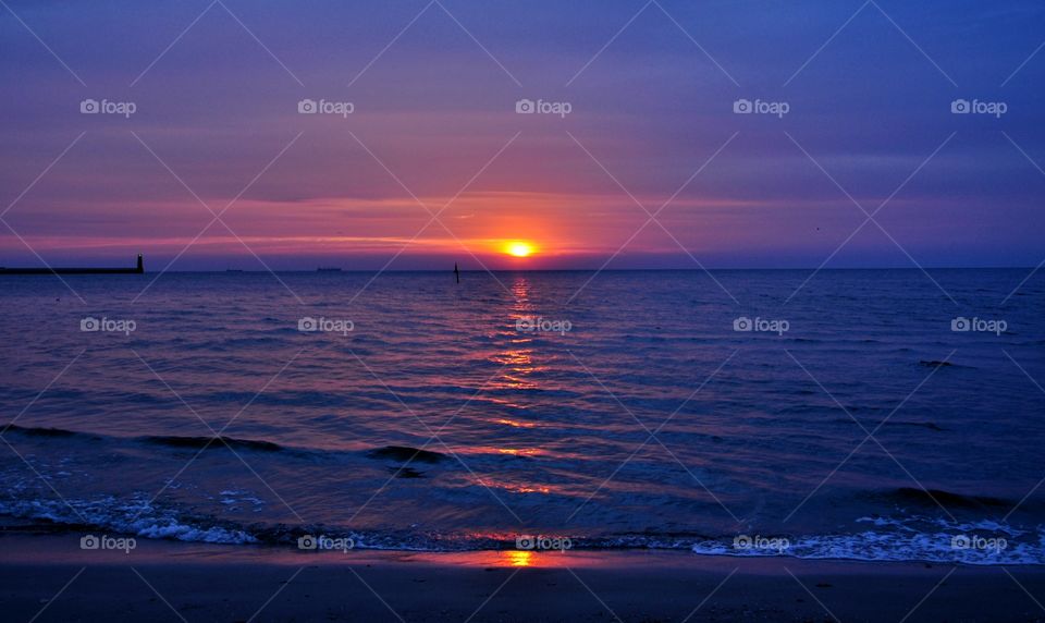 purple sunrise over the Baltic sea in Poland