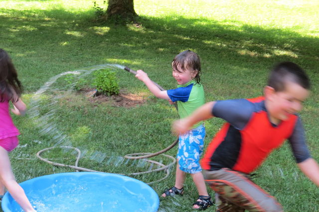 Children playing in a pool.