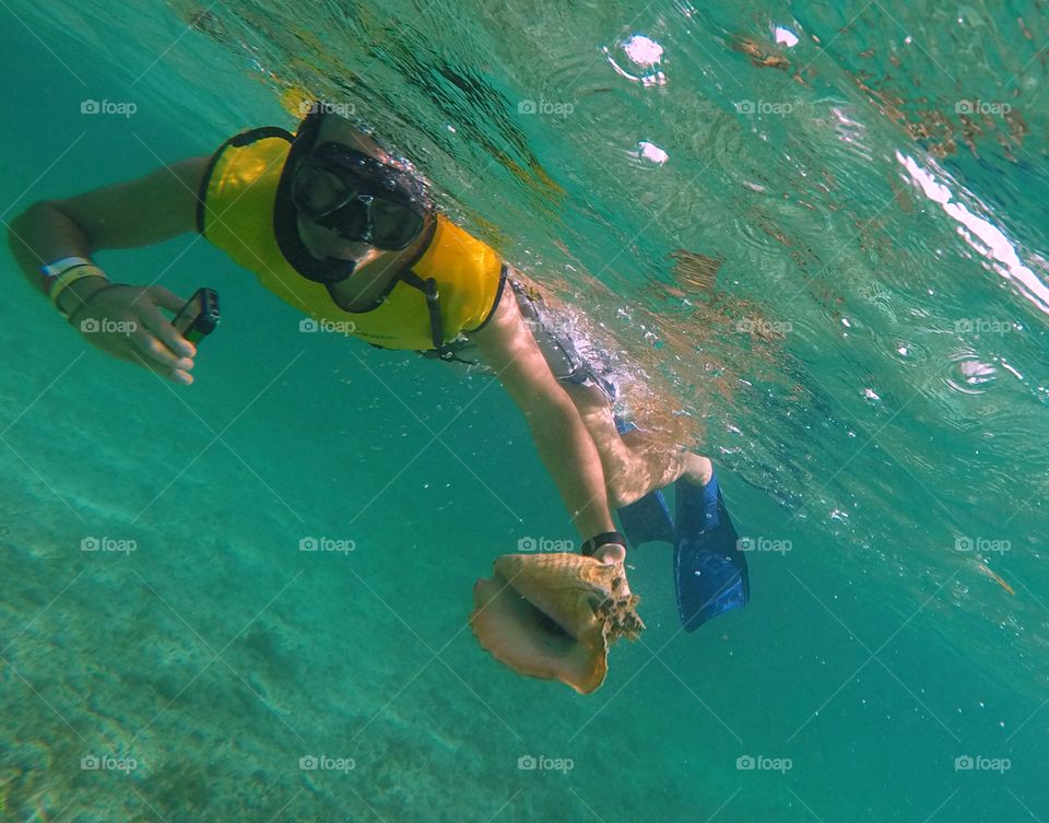 snorkeling in The ocean with the seashell