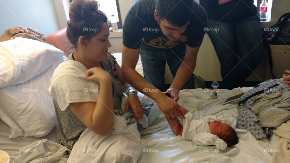 father and son first diaper change