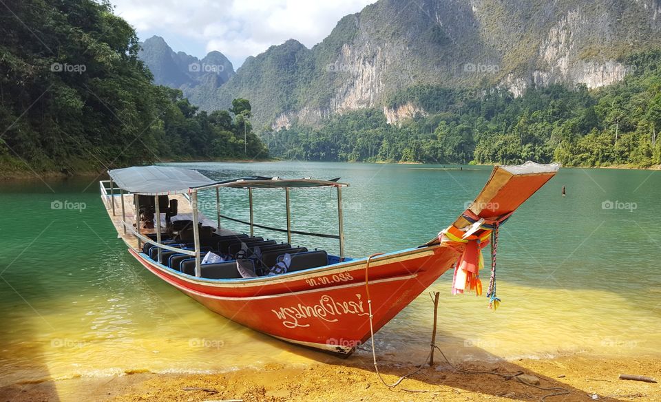 Colorful long tail boat in the lake