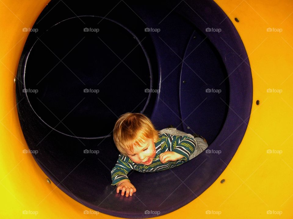 Toddler In A Tunnel
