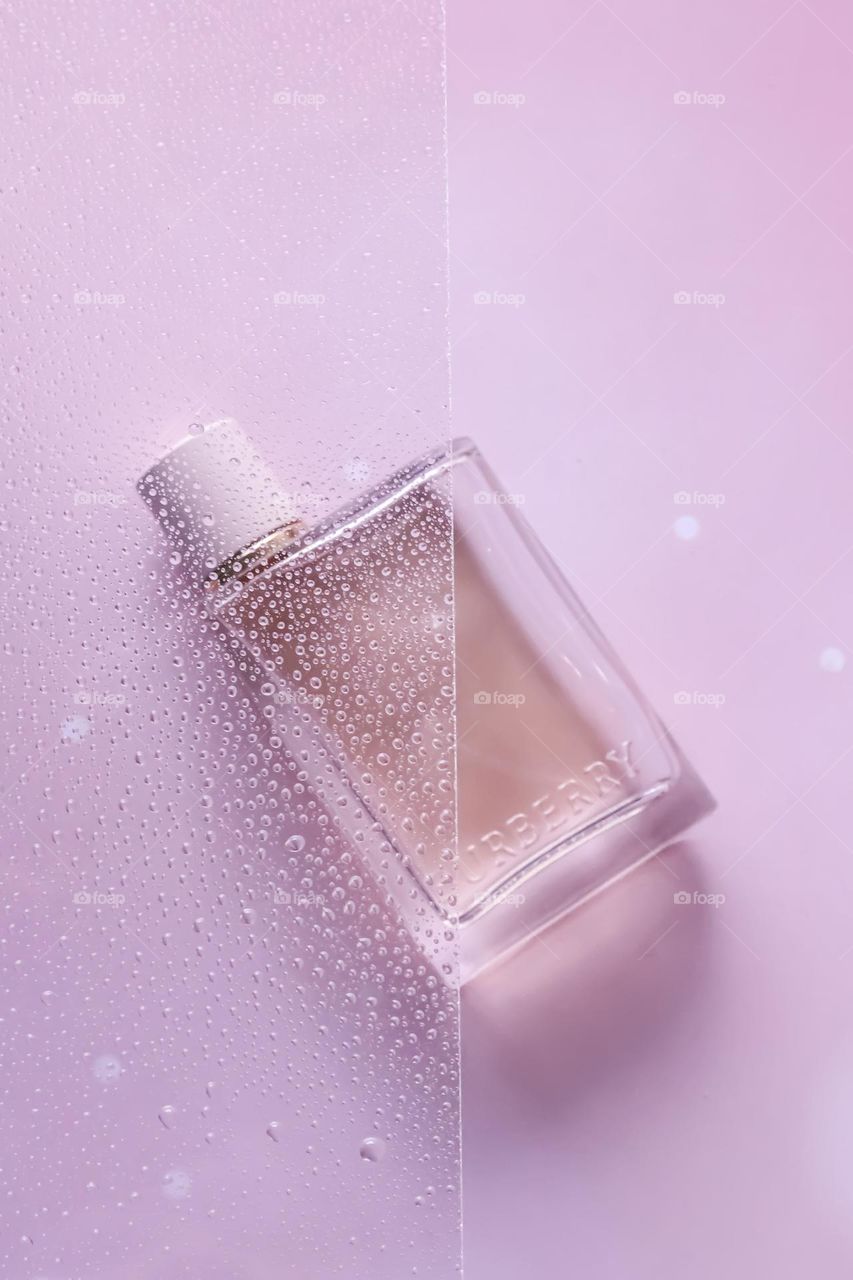 Pink perfume from  Burberry with water droplets on top