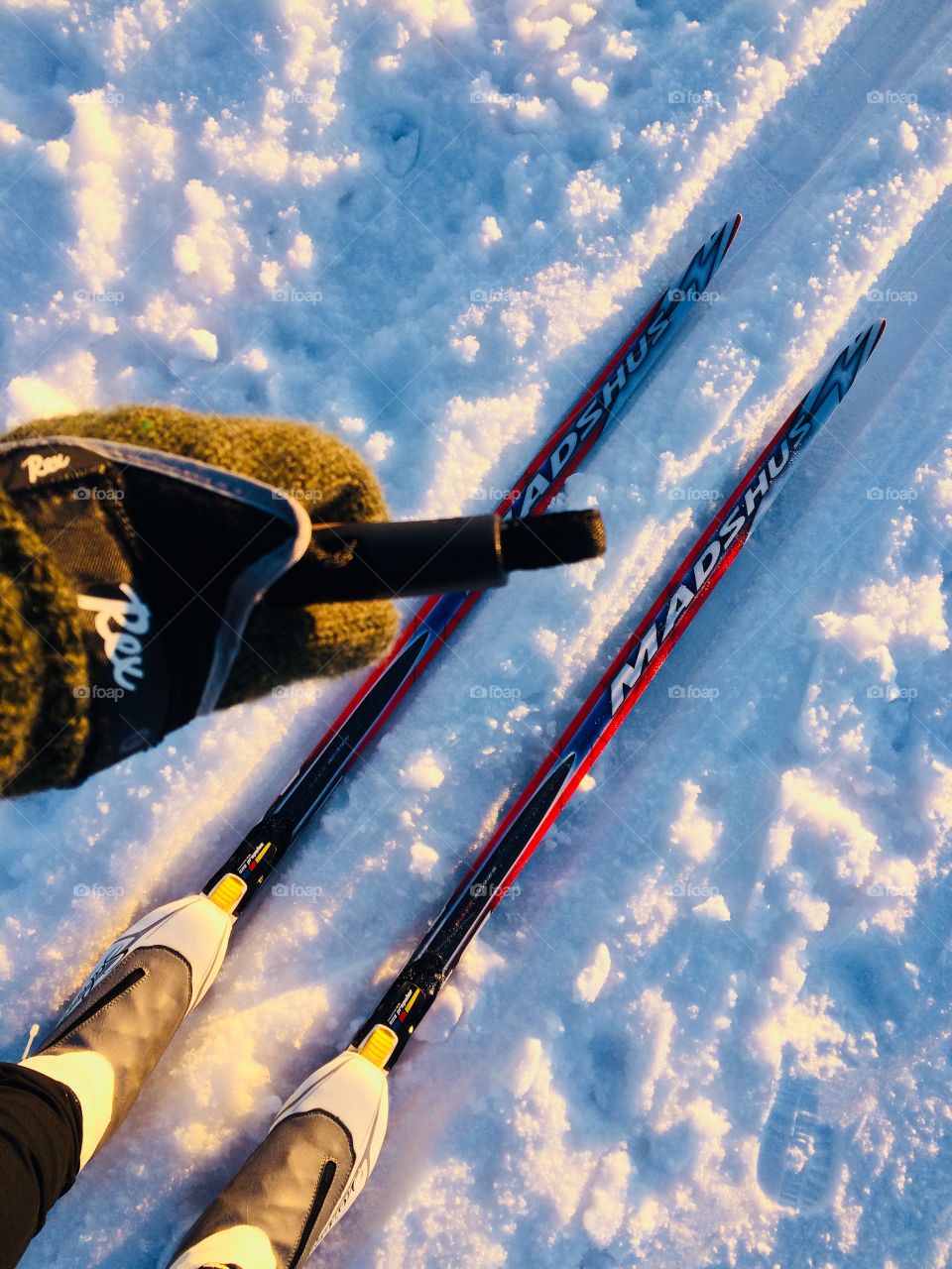 Cross country skiing on a Frozen lake in Sunset 