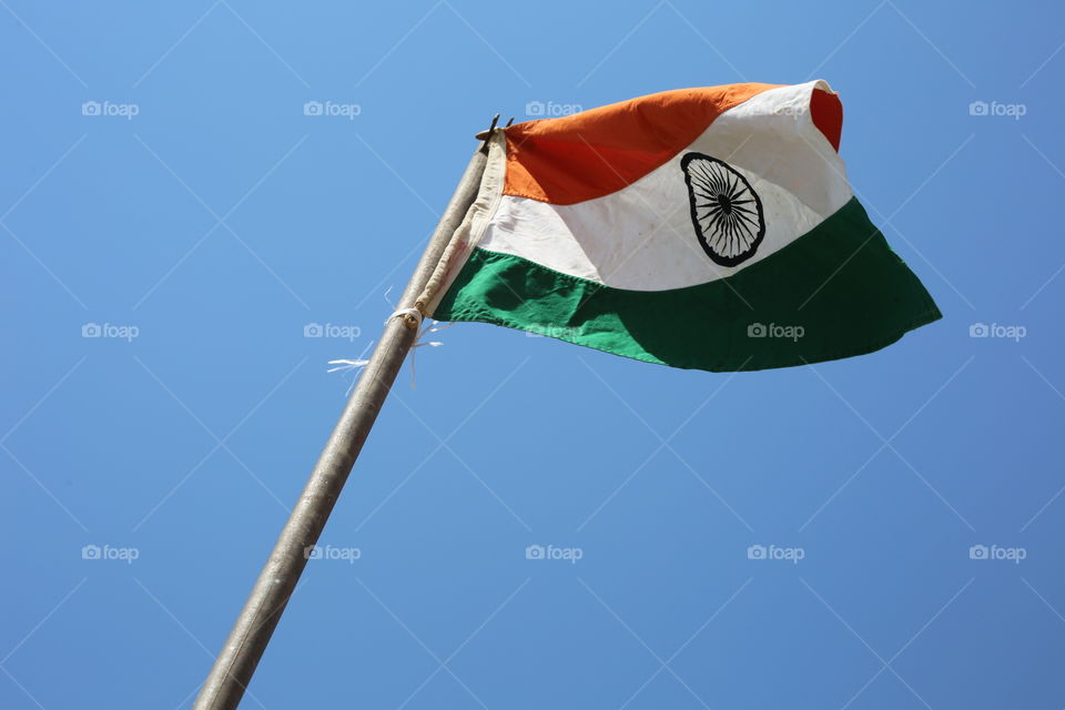 The flag of India waving over a primary school.