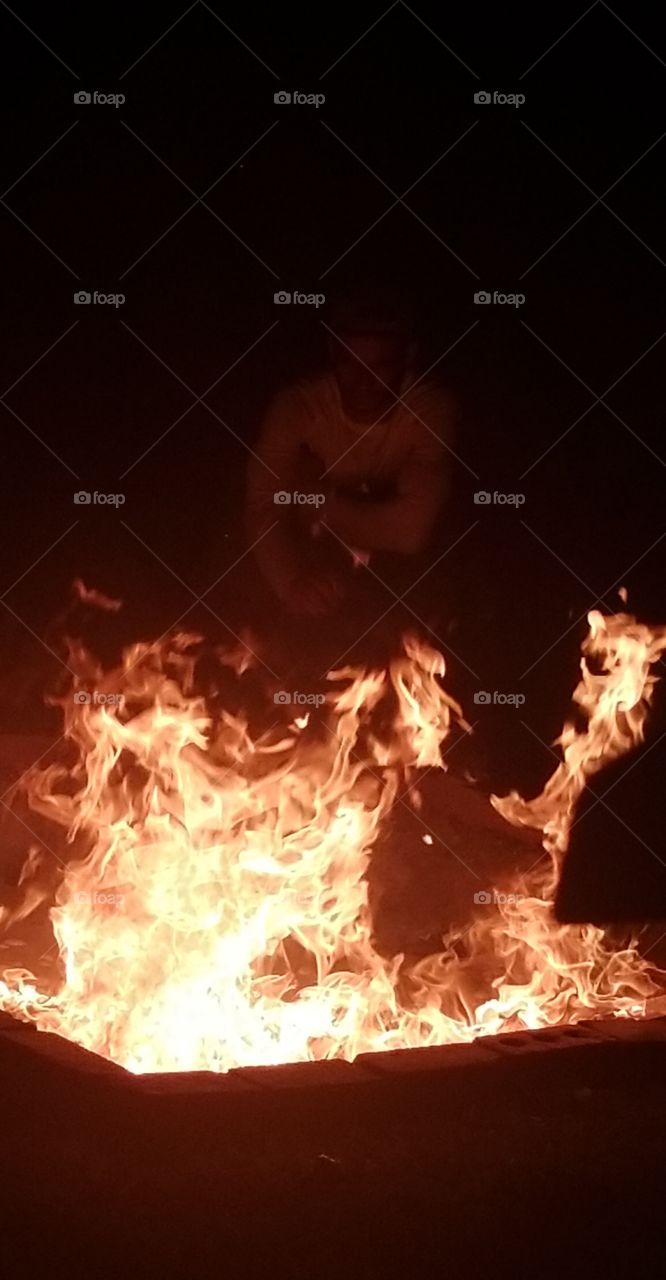 head coming out of fire, bonfire
