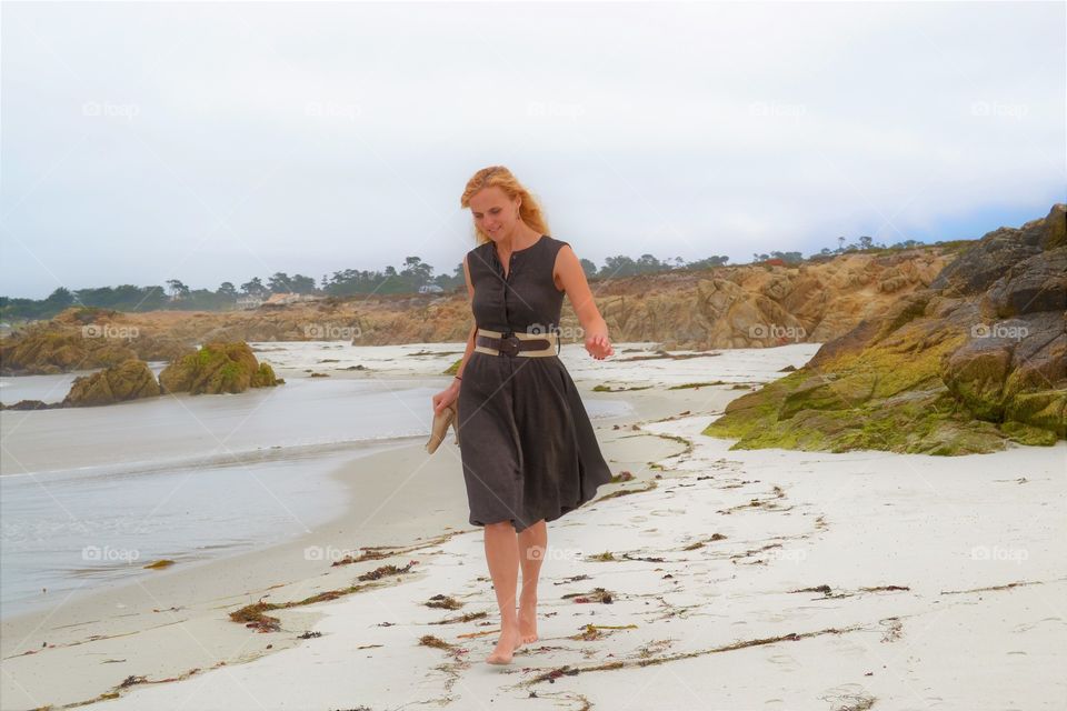 Women in west coast on the beach walking 