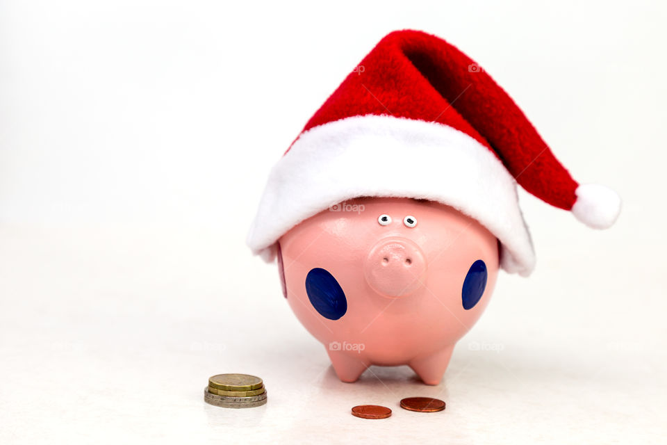 piggy bank in Santa Claus cap