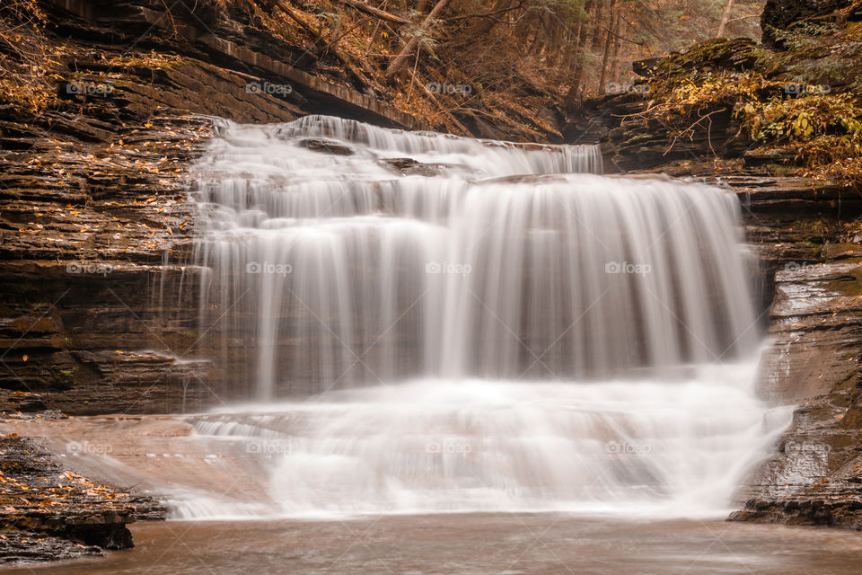 Perfect waterfall surrounded by autumn colors.