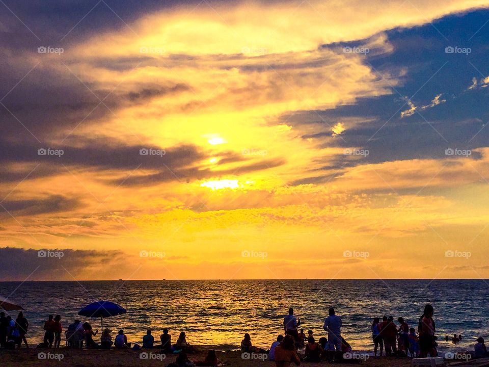 Sunset, people, and the ocean!