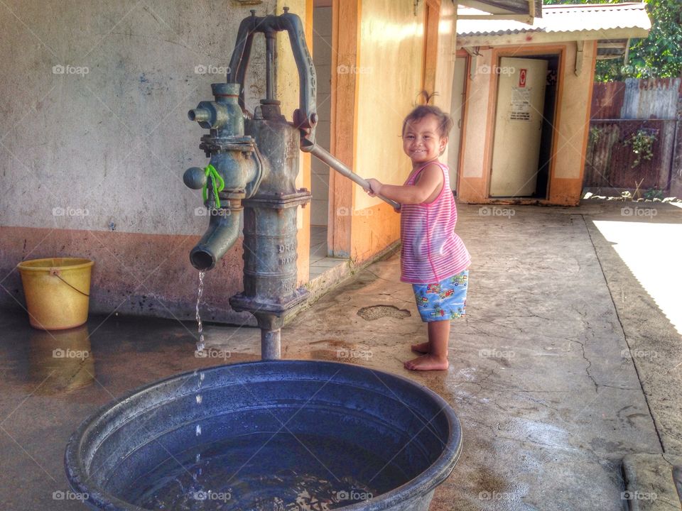 Hi. My name is Jeremiah. I'm pumping water for mama