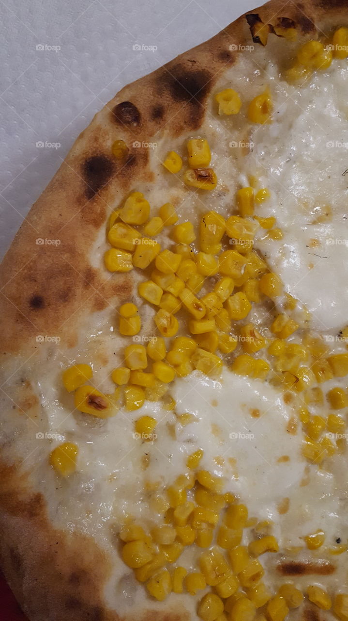 Pizza with mozzarella and maize