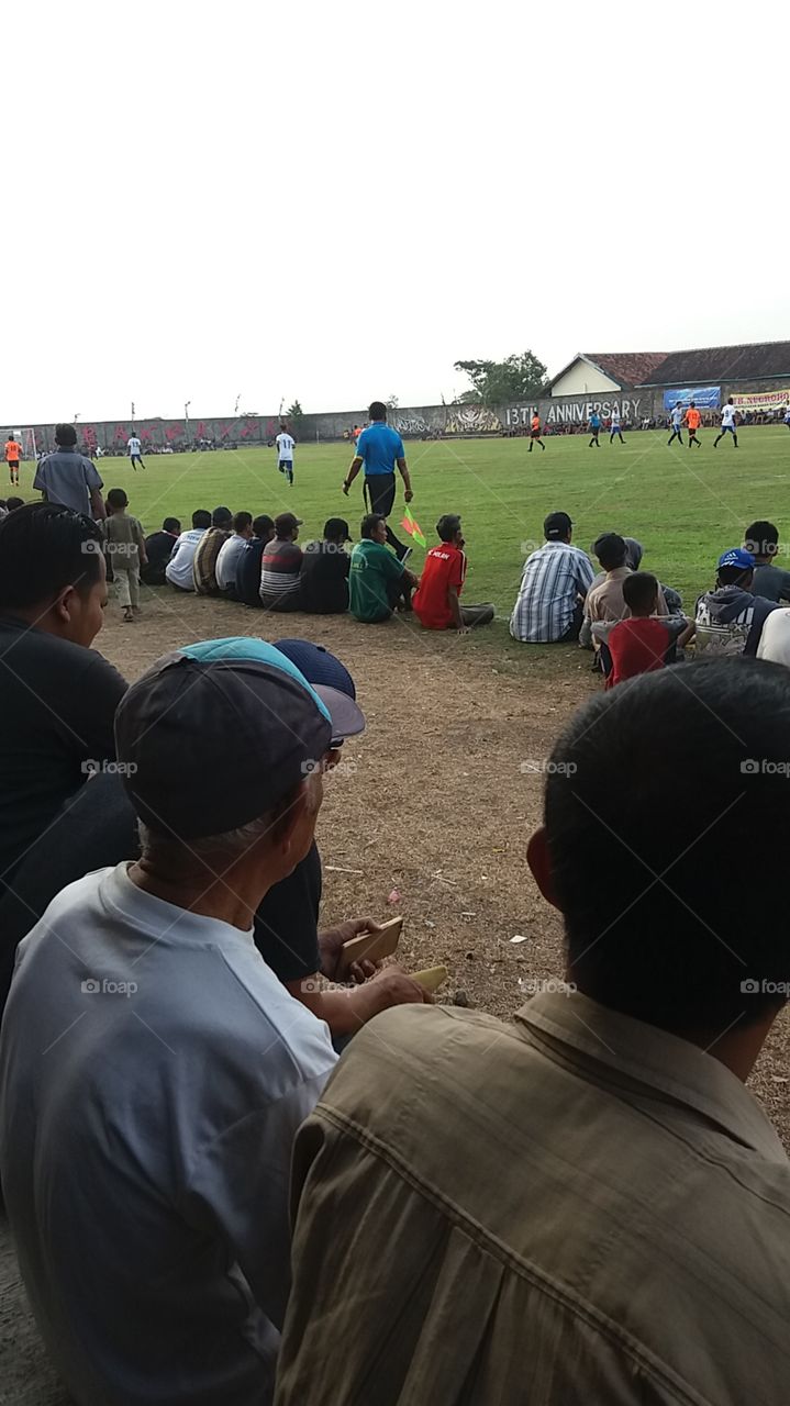 He who is dressed in blue is the referee in the PERSEKA CUP 2018 competition