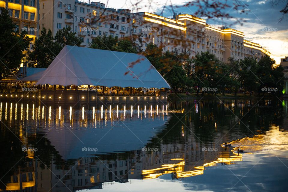 pond and fish restaurant on the water evening time