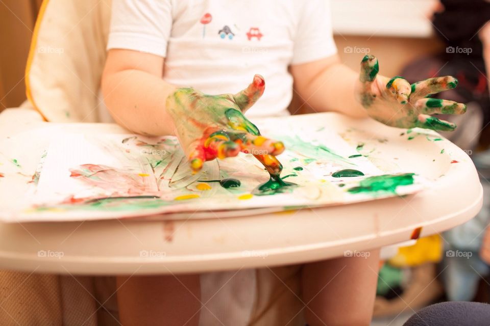 Close-up of child painting