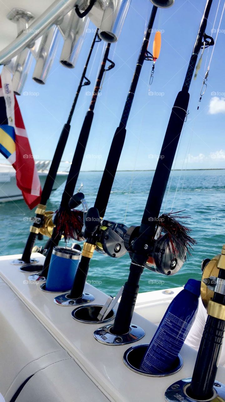 Colorful Fishing rods on a boat on the way out of bimini for a fun fishing trip
