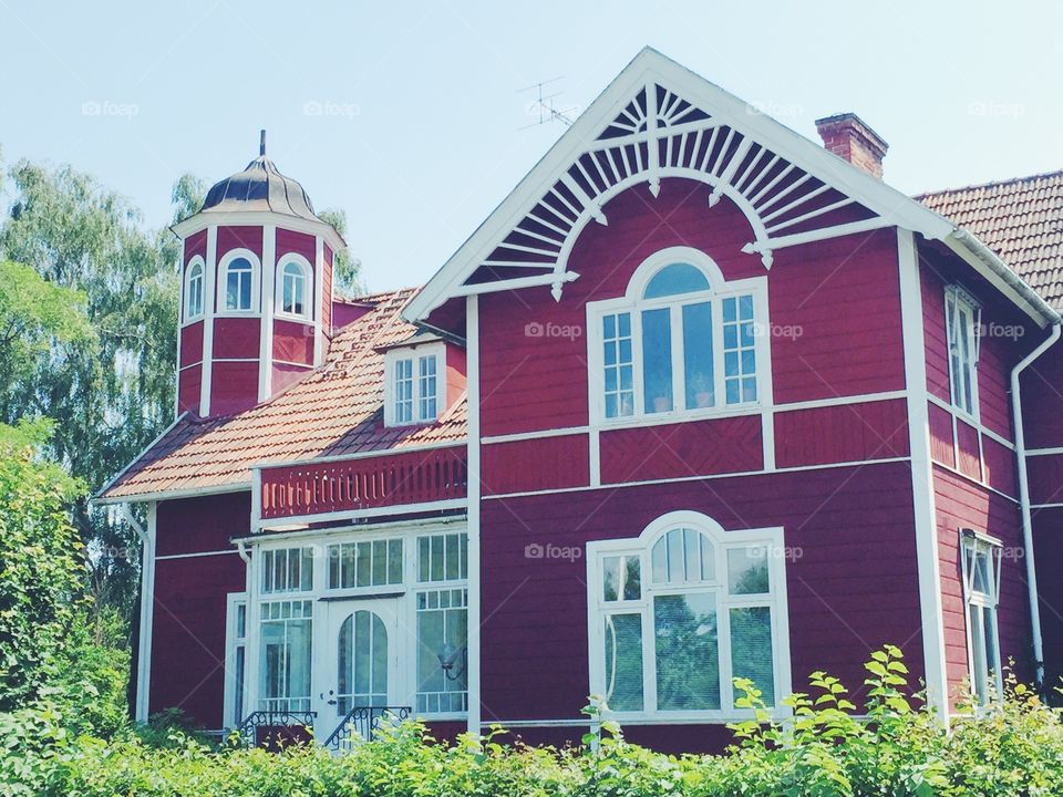 Very pretty red and white wooden house