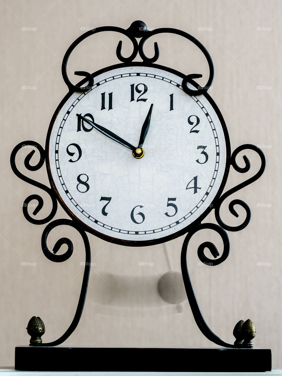 vintage table clock with blurred pendelum in motion