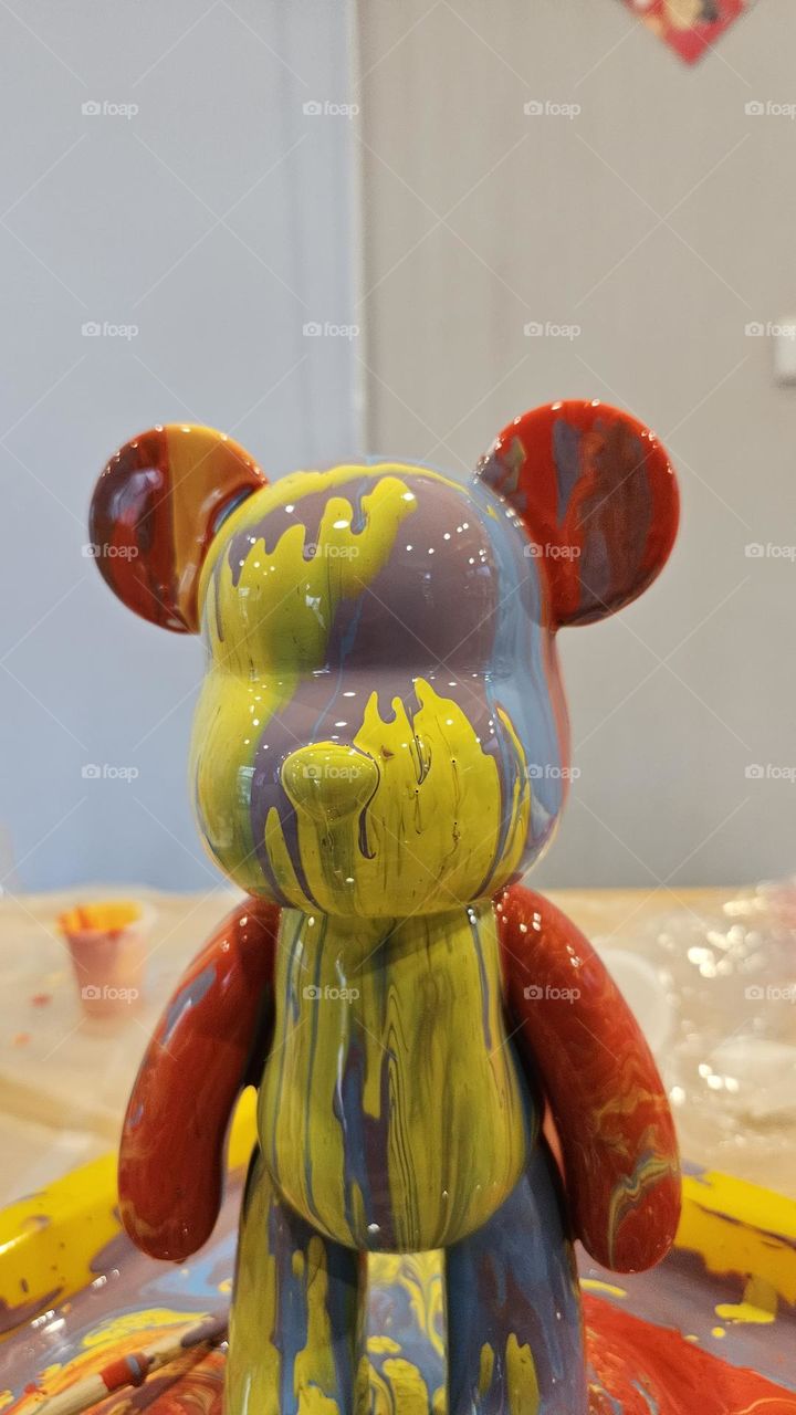 a pouring art toy bear