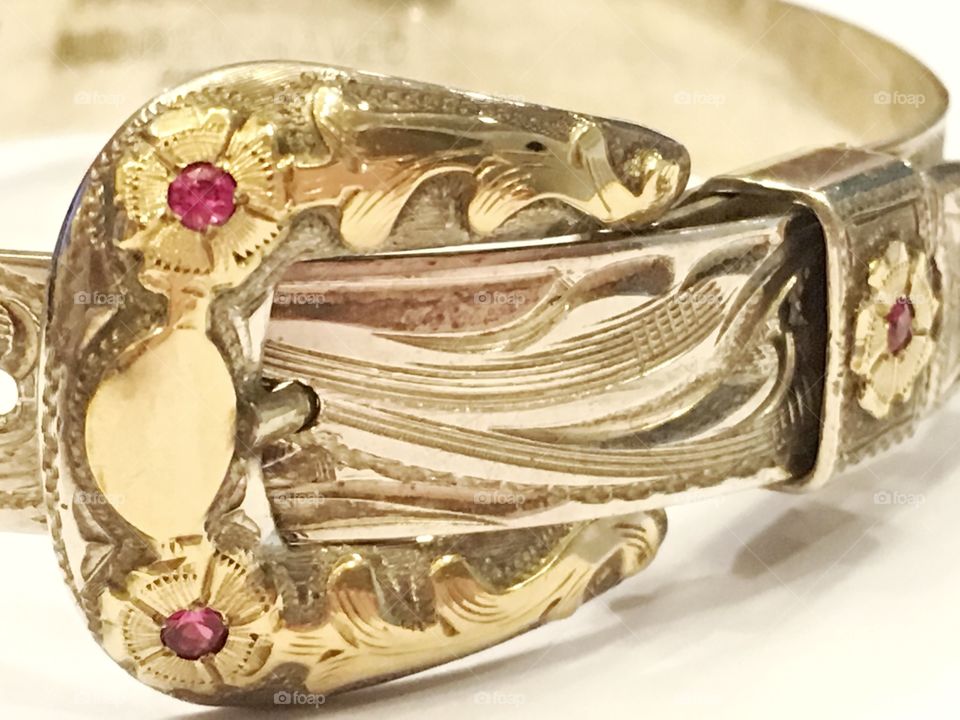 Handmade silver bracelet with gold and rubies. 