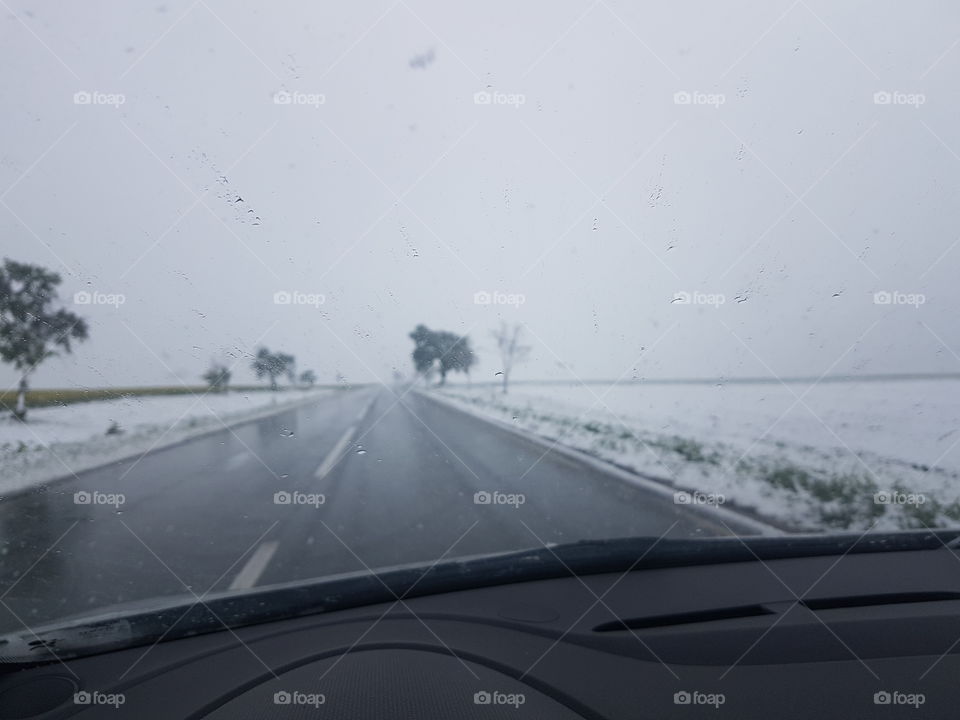 vintage winter landscape. loneliness. whiteness . highway covered with snow. snow storm.