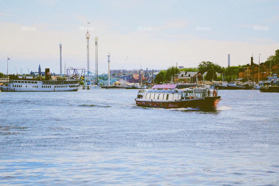 Stockholm in the background and a ferry in the foreground at summertime 