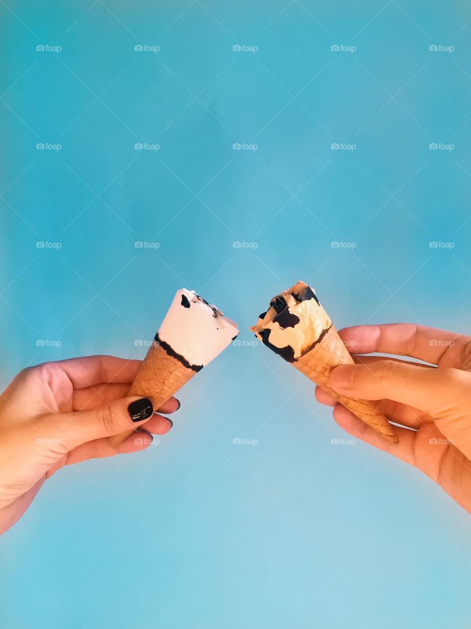 Hands holding ice cream cone