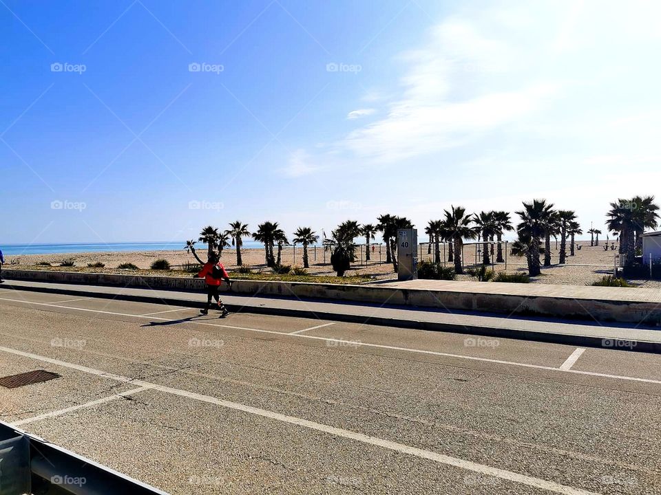 Race walking.  The girl is walking along the road