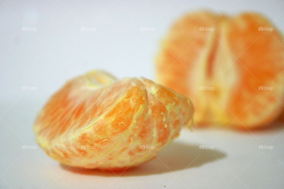 Orange . A close up of a peeled orange.
