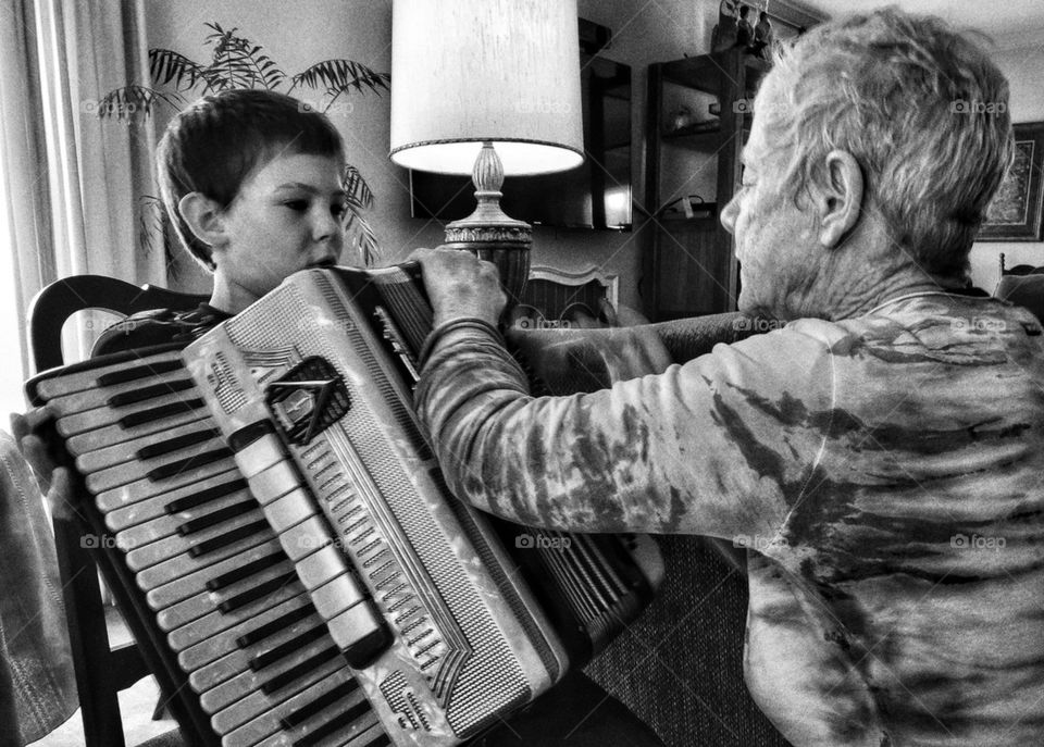 Boy learning to play accordion